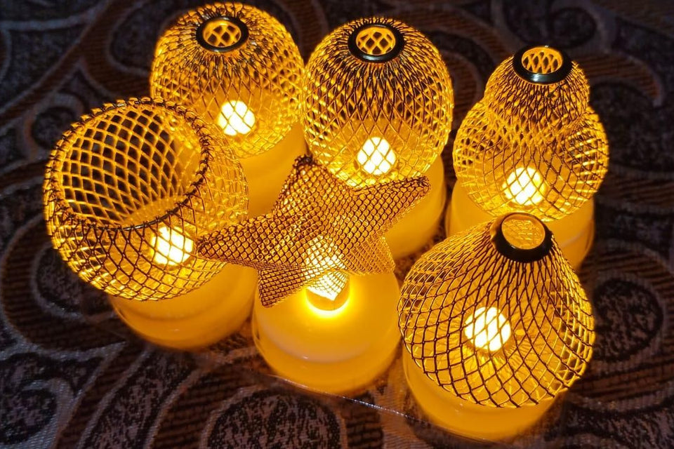 String lights with mesh-covered bulbs on a textured surface