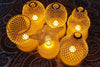 String lights with mesh-covered bulbs on a textured surface